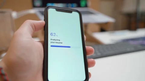 Resume analysis progress on smartphone screen. Score result appears after scan Stock Footage 343237960