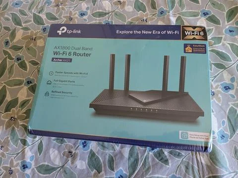 Retail box of a TP-Link Archer AX21 dual-band Wi-Fi 6 router Stock Photos