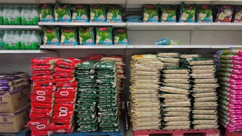 Retail Display of Packaged Rice Varieties Stock Footage 320558938