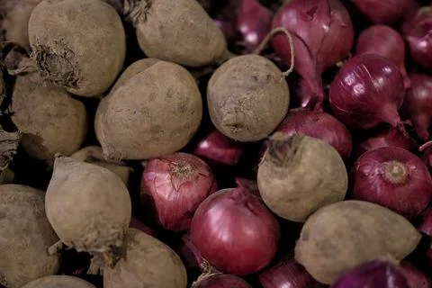 Retail Display of Raw Beets and Red Onions, Selective Focus Stock Photos