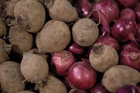 Retail Display of Raw Beets and Red Onions, Selective Focus Stock Photos