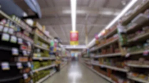 Retail grocery store blurred view travel through a food aisle looking towar.. Stock Footage 231716337