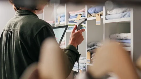 Retail, Shopper Concentratedly Selecting Items Clothes to Buy In Hands an El Vídeo Stock 234428763