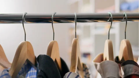 Retail, Shopper Relaxed Selecting Clothes from Huge Variety Warehouse of Clo 库存影片 233526109