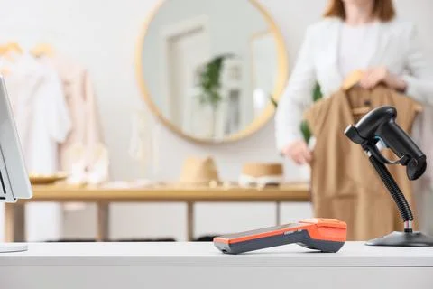 Retail store checkout counter with barcode scanner and payment terminal, sale Stock Photos