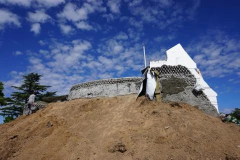 Retaining wall and construction site of an earthship house Stock Photos