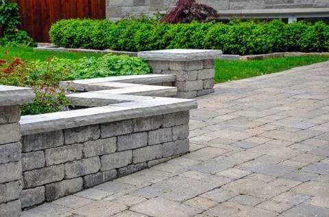 Retaining wall with pillars and coping Stock Photos