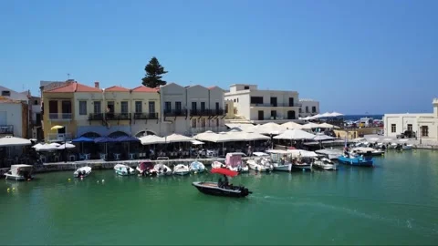 Rethymno old harbour with castle background Stockbeeldmateriaal 249944448