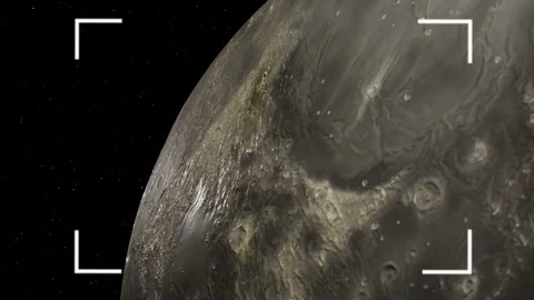 The reticle of a camera looks over the rotating surface of the Moon. Stock Footage 110340123