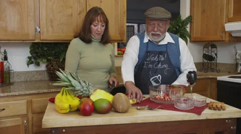 Retired Couple Cutting Fruit Stock Footage 35329568