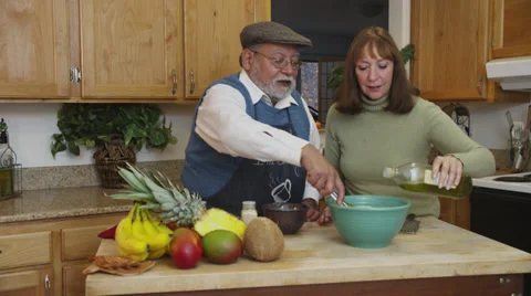 Retired Couple Making Pasta in Kitchen Stock Footage 35323497