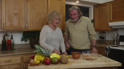 Retired Couple Preparing Fruit Salad Stock Footage 35326449