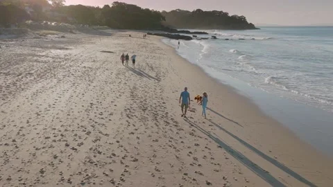 Retired couple taking an evening stroll on the beach, Langs beach, New Zealand Video stock 190623640