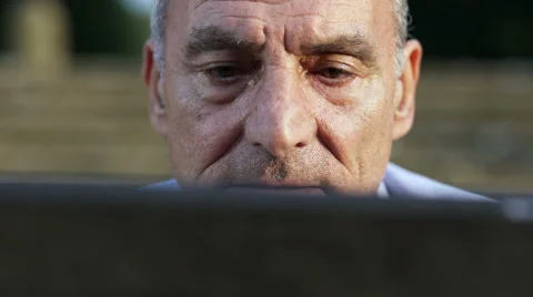 Retired man focused on his tablet Stock-Footage 68572277