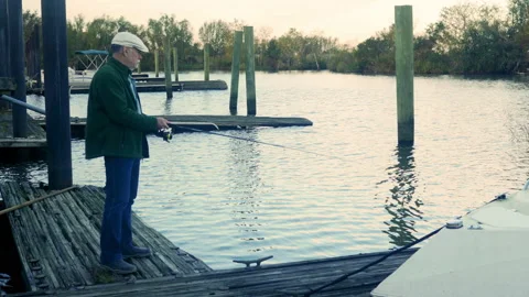 Retired man spending his day fishing Stock Footage 167047053