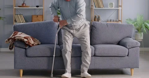 Retired old senior man, elderly person alone at home, sitting on couch, stand up Stock Footage 294291027