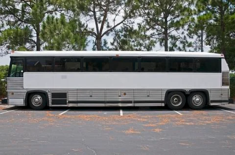 Retired tour bus with tinted windows waiting to be sold Stock Photos