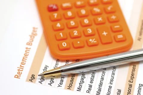 Retirement plan document with pen and calculator Stock Photos