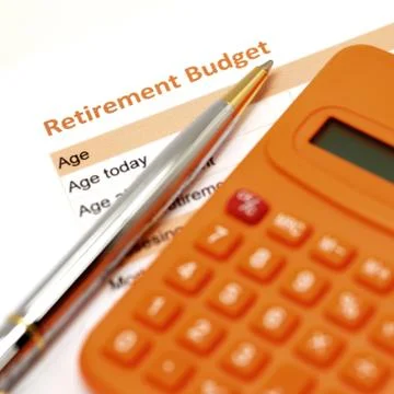 Retirement plan document with pen and calculator Stock Photos