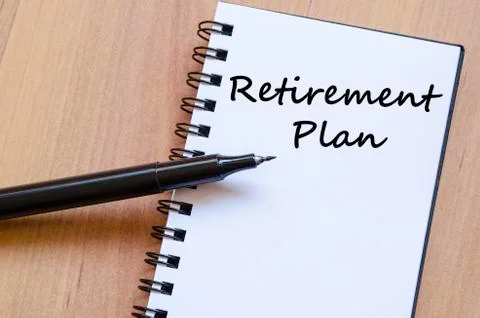 Retirement plan write on notebook Stock Photos