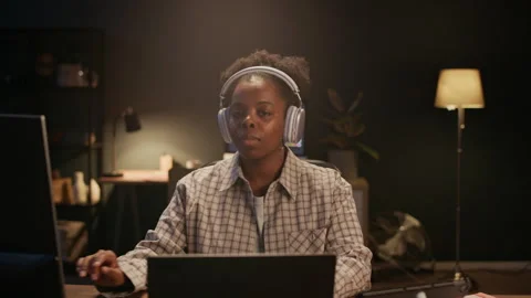 Retoucher Working on Computer and Looking at Camera Stock Footage 329509788