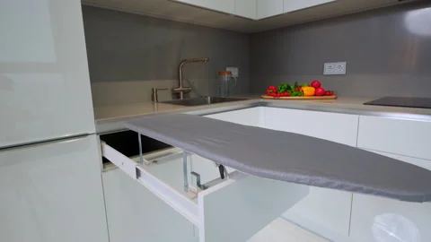 Retractable grey ironing board. moving slider forward Stock Footage 163249869
