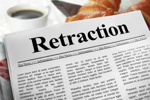 Retraction in newspaper layout on a breakfast table with a blurry cup of co.. Stock Photos