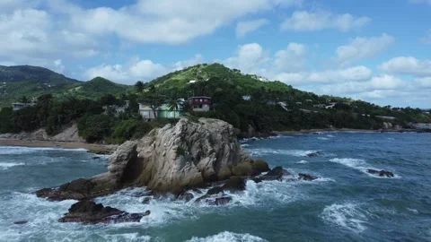 Retreating Aerial Drone Pull Shot over Caribbean Beach with Crashing Waves Stock Footage 273734190
