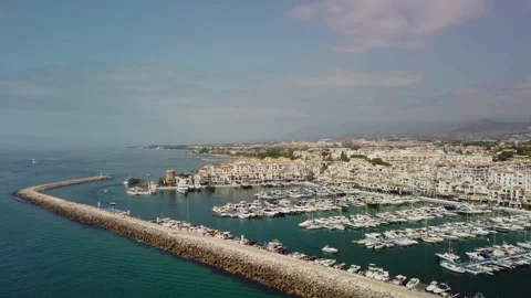 Retreating Drone View of Puerto Banus Marina - Aerial Retreat Shot Stock Footage 263440887