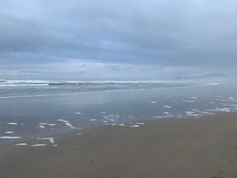 Retreating waves view of beach 写真素材