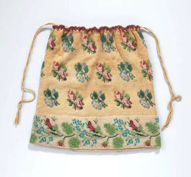 . Retricule in a flat rectangular model of knitted ecru-colored cotton wit... 库存照片