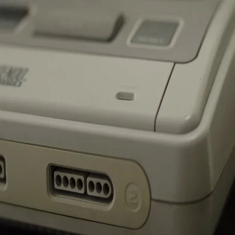 Retro 16-bit console is switched on Stock Footage 69704603