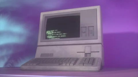 Retro 1980s Computer Displaying Green Code on Screen With Vaporwave Background Stock Footage 308482883