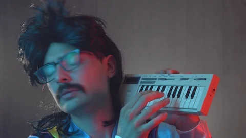 Retro 80s Man Playing on a Synth Keyboard Stock Footage 114252097