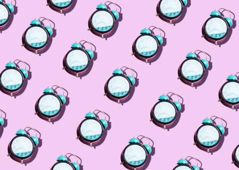 Retro alarm clock art pattern on pastel background Stock Photos
