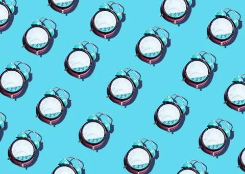 Retro alarm clock art pattern on pastel background Stock Photos