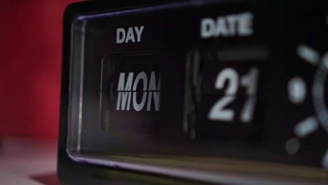 Retro alarm clock display changing day and date close up, dark room, Stock Footage 344432472