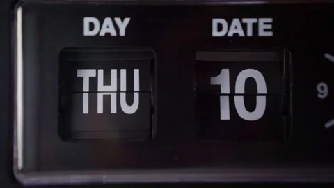 Retro alarm clock flipping day and date numbers close up, dim lighting, Stock Footage 344012158