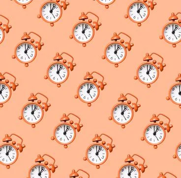 Retro alarm clock pattern on coral background. Time, accuracy concept Stock Photos