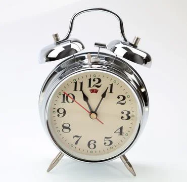 Retro alarm clock on plain background Stock Photos