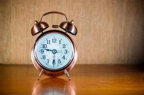 Retro alarm clock on table Stock Photos