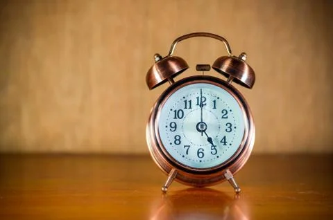 Retro alarm clock on table Stock Photos