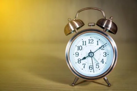 Retro alarm clock on table Stock Photos