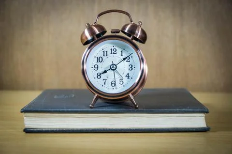 Retro alarm clock on table Stock Photos