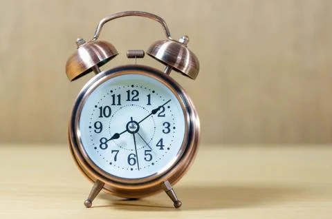 Retro alarm clock on table Stock Photos