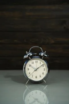 Retro alarm clock on table Stock Photos
