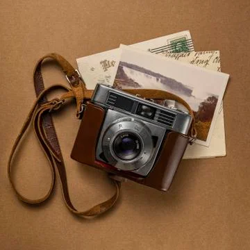 Retro amateur 35mm camera with postcards and letters Stock Photos