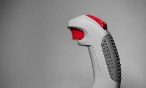 Retro arcade joystick with red button bokeh background Foto stock