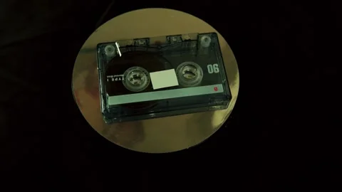 Retro audio tape rotating on a display stand. Stock Footage 327687693