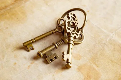 Retro background brass keys Stock Photos